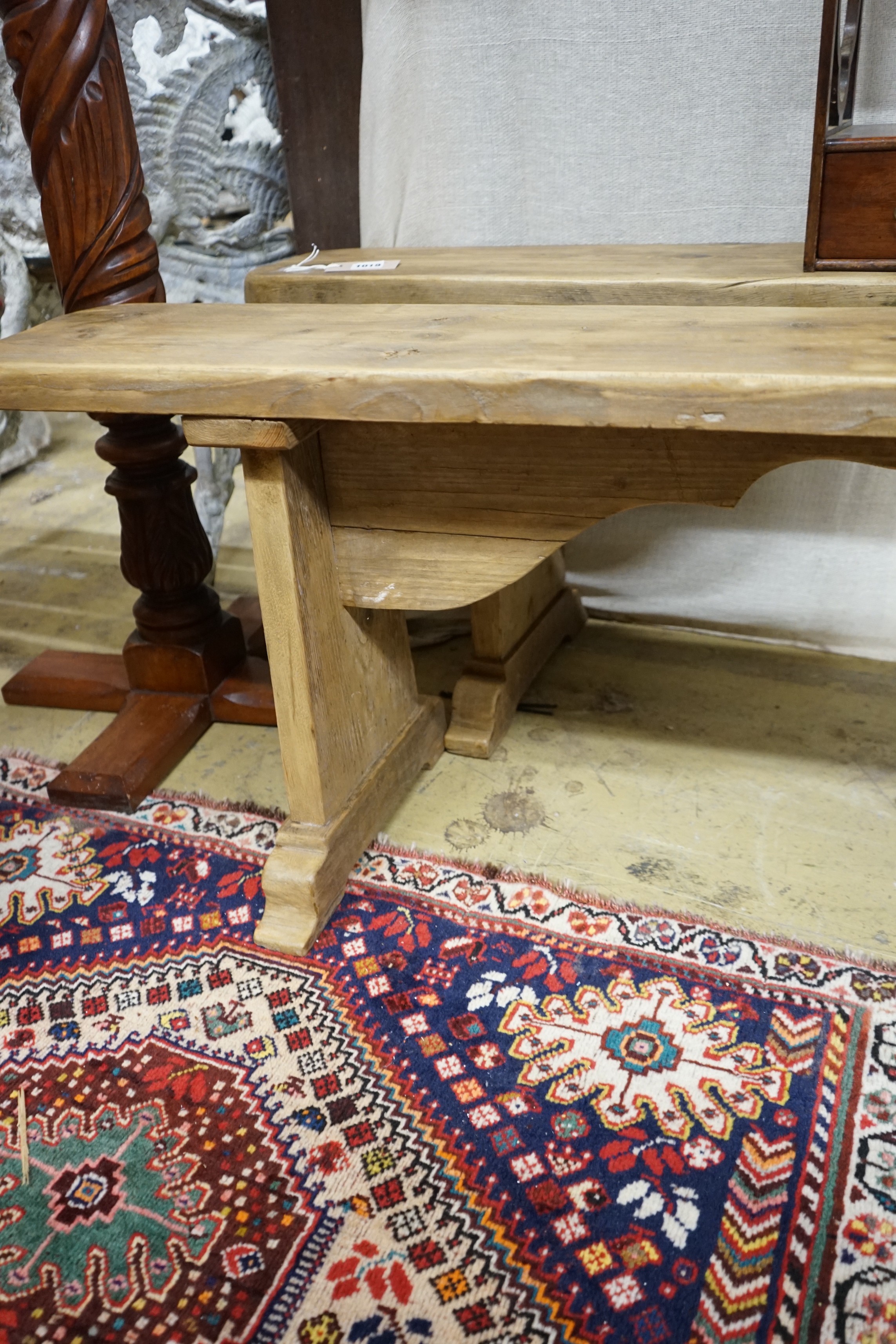 A pair of 19th century provincial pine benches, length 179cm, depth 22cm, height 47cm